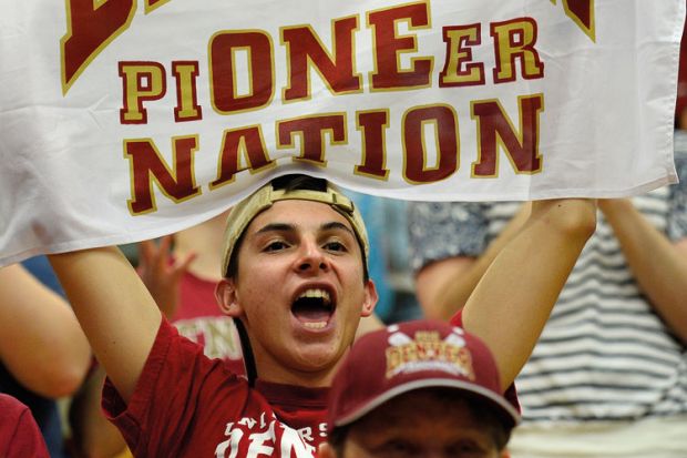 A man holding up a banner