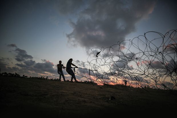 pulling barbed wire