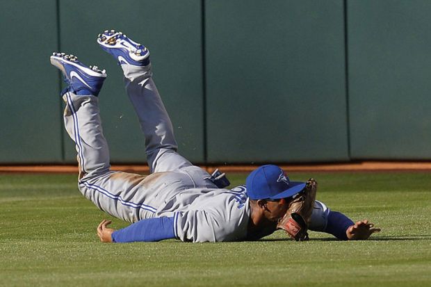 Baseball player Anthony Gose, Toronto Blue Jays, falls on ground