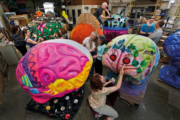 Artists painting brain sculptures