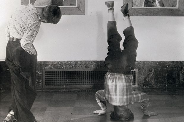 Boy standing on his head