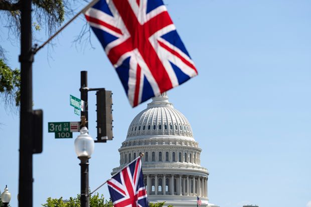 Union Jack flags flying near the US Capitol, illustrating that a record number of US students have applied to study undergraduate degrees in the UK