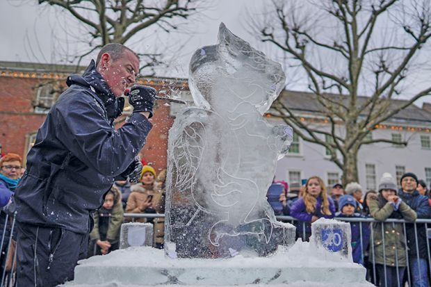 An artist carves an ice sculpture - to illustrate how a tuition fee cap could threaten foundation courses