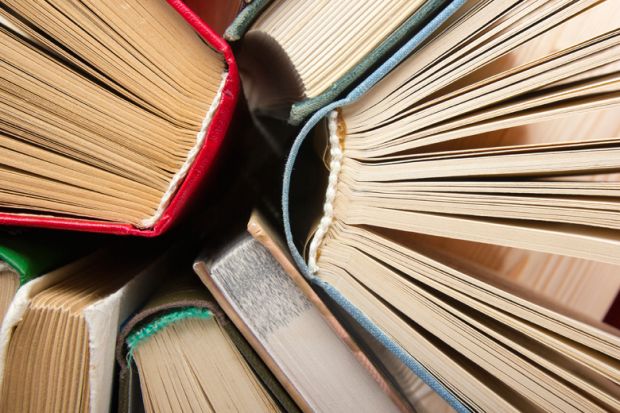 Circle of closely-grouped books photographed from above