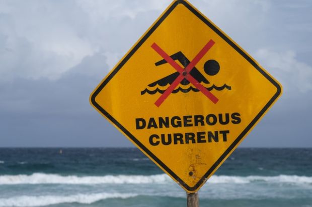 A sign in Australia reading "dangerous currents"