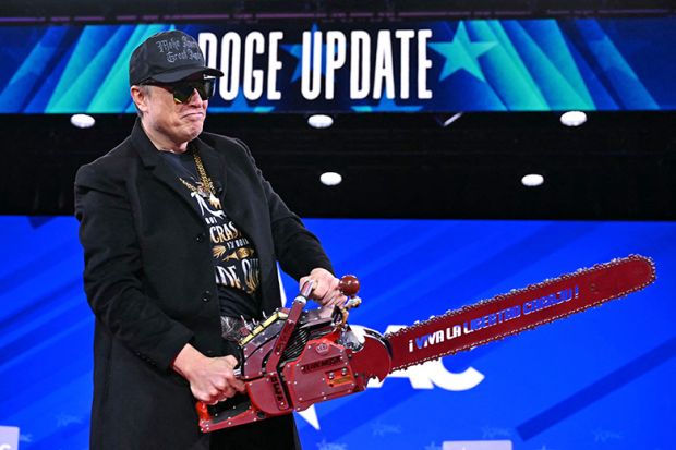 Elon Musk, head of DOGE, holds a chainsaw during the annual Conservative Political Action Conference (CPAC) at the Gaylord National Resort & Convention Center at National Harbor in Oxon Hill, Maryland, on 20 February 2025