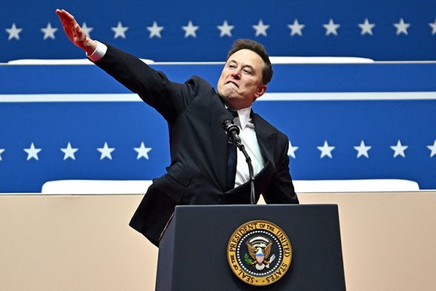 Tesla and SpaceX CEO Elon Musk gestures as he speaks during the inaugural parade inside Capitol One Arena, in Washington, DC, on 20 January 2025