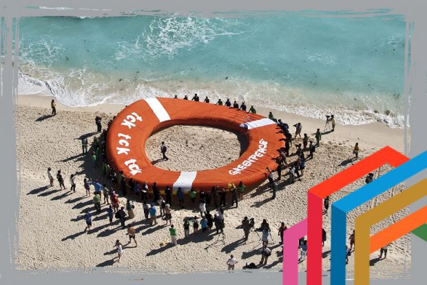 People flocking around giant lifebelt to suggest how business can build coalitions to promote sustainability and rescue the planet