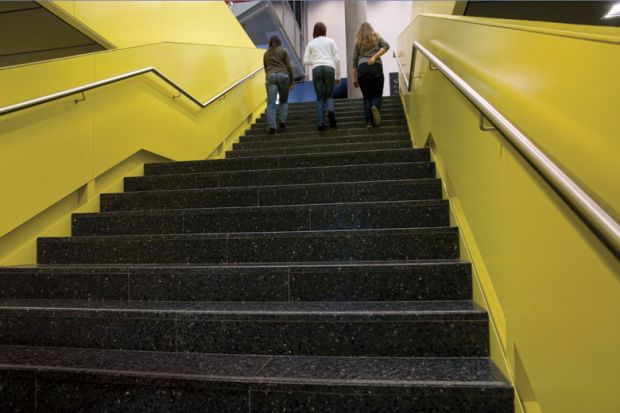 Girls climb stairs