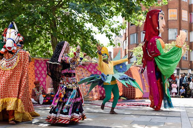 Performers at the Leicester Belgrave Mela, with a tree in the background. To illustrate the University of Leicester's proposal to set up a branch campus in India.