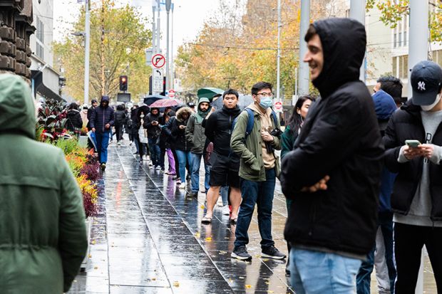  International Students are seen lined up outside the Melbourne Town Hall, Australia