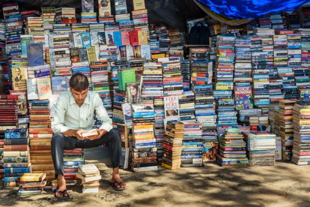 Books for sale at street side market stall near Flora Fountain in Mumbai.