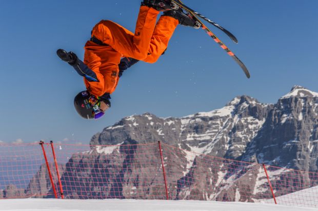 Freestyle skier flips upside down