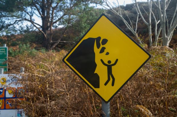 Yellow falling rocks sign