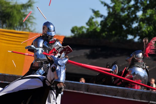 A knight on horseback jousting