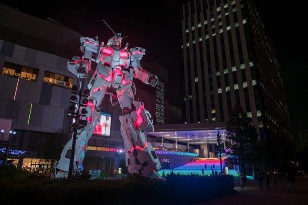 Gundam, real size model, light up at Divercity Tokyo plaza at night in Oodaiba area.