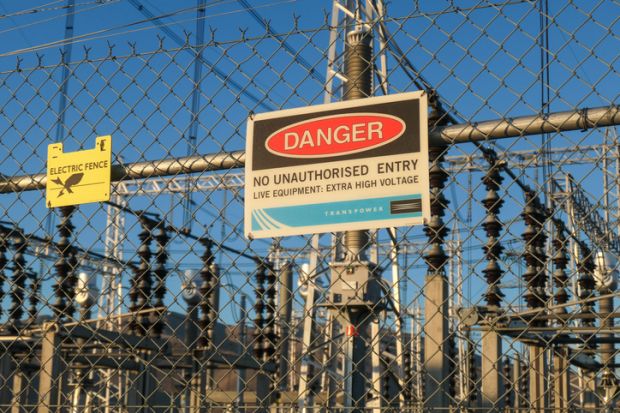 Danger sign on fence of an electricity substation