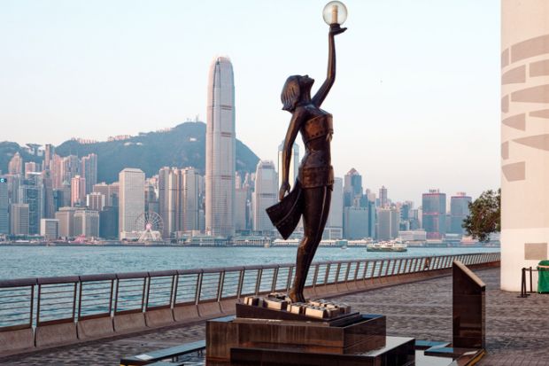 Hong Kong cityscape view from across Victoria Harbor in the morning.