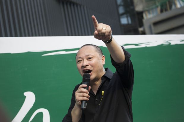 Benny Tai Yiu-ting, co-founder of Occupy Central With Love and Peace (OCLP), speaks outside the government complex in Admiralty district.