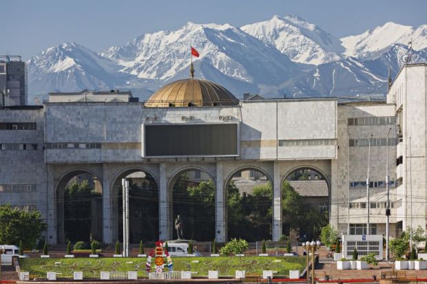 View over the city centre of Bishkek with snow capped mountains in the background.