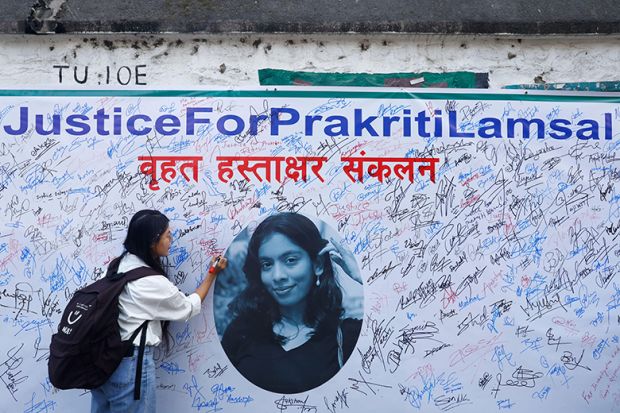 A student signs a petition demanding justice for Prakriti Lamsal, a Nepali student who recently died by suicide in her hostel room following alleged harassment by a batchmate at Kalinga Institute of Industrial Technology (KIIT)in India.