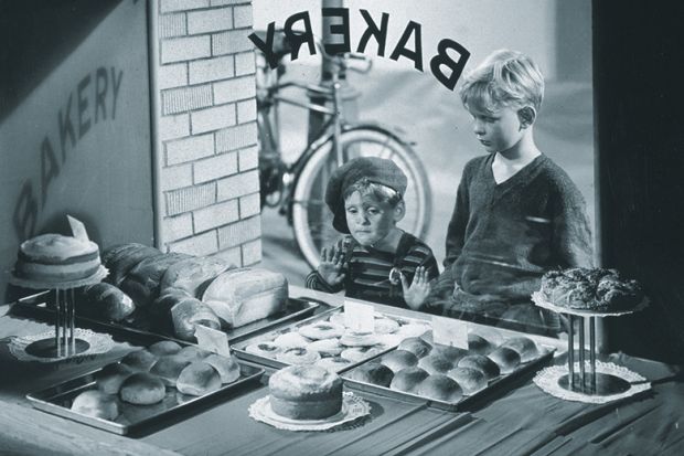 Kids looking through bakery window