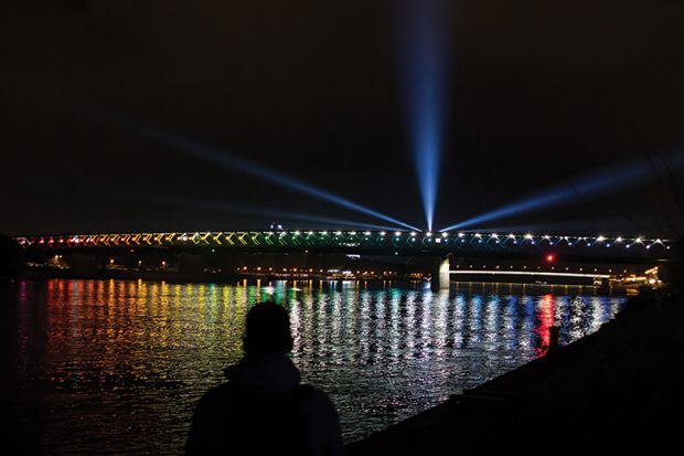 lights reflecting in water at night