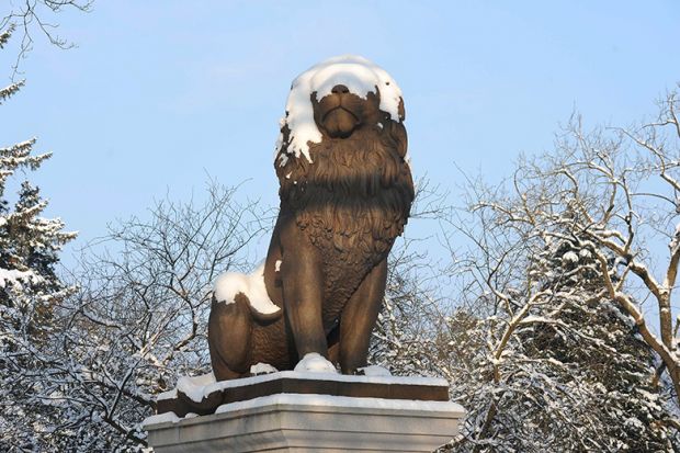 Lion statue covered in snow in Germany. To illustrated concerns about Germany's deal with the open access publisher MDPI, which some believe may be linked to predatory journals