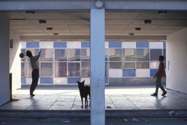 Man and young boy shooting soccer penalties, Glasgow, Scotland