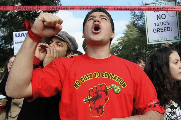 Man protesting cuts to education