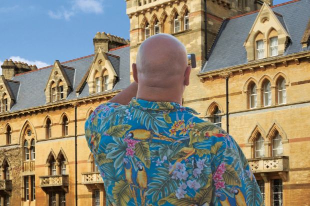 Man using smartphone to photograph Meadow Building, Christ Church College, University of Oxford