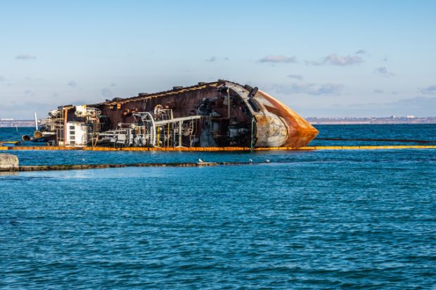 Odessa, Ukraine 12.04.2019. The wreck of a small tanker `DELFI` off the coast of Odessa on a sunny winter day