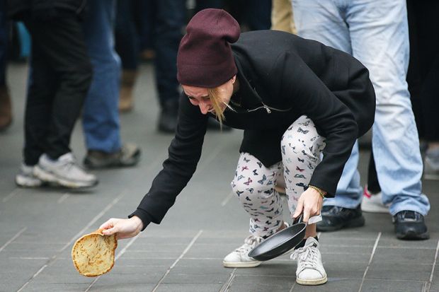 woman drops pancake