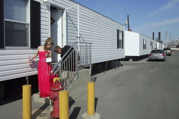 A couple leave a temporary trailer for their high school prom in Chalmette, Louisiana. To illustrate that universities in the USA may need to adapt for non-traditional students in order to tackle the enrolment cliff.