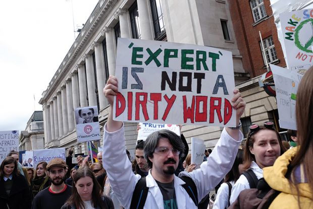 Protesters carrying signs