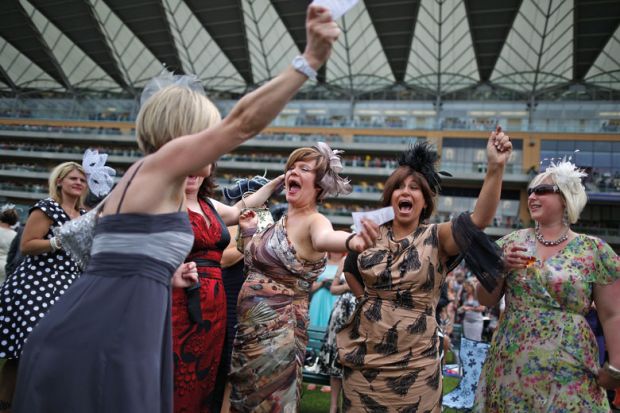 Racegoers celebrate win, Royal Ascot, England