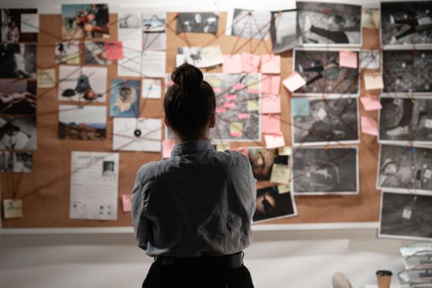 A detective studying an investigation board, symbolising data sleuthing