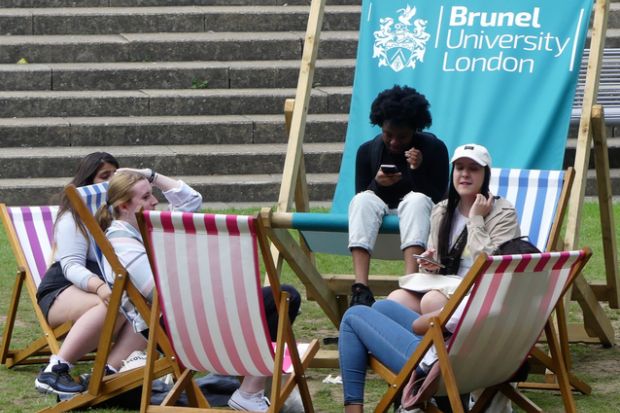 Students relaxing on deck chairs at Brunel University London