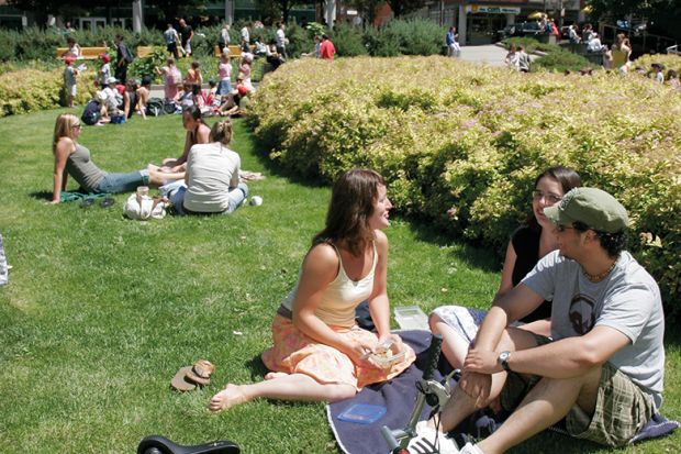 Students sitting on a lawn