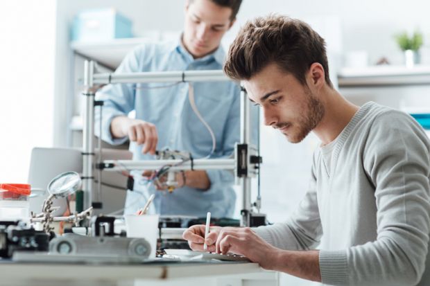 University students working on a patentable invention