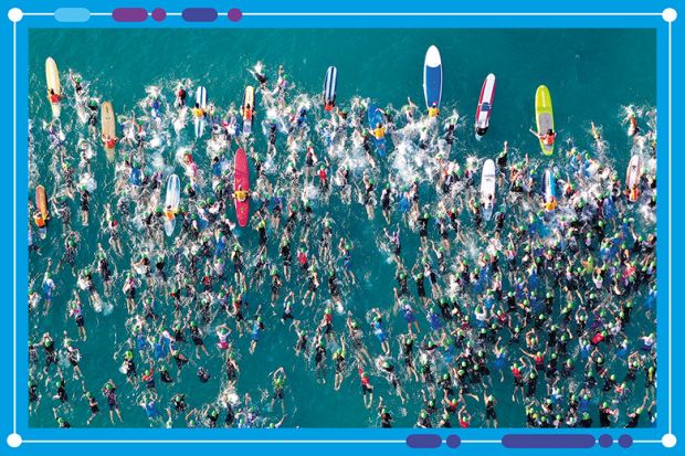 Aerial view of an iron man swimming event, to illustrate the shifts in positions of universities in the World University Rankings