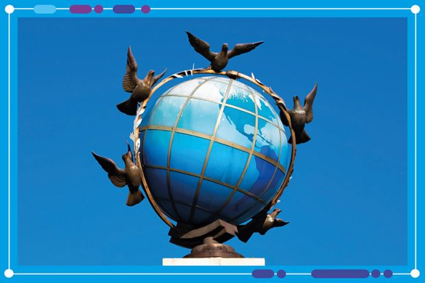 A statue of A blue terrestrial globe with doves of peace around It in Independence Square, Kiev, Ukraine