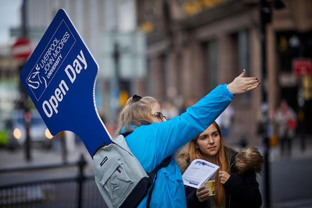 University open day guide and student, illustrating the record number of UK 18-year-olds applying to university.