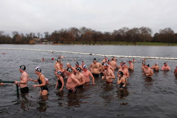  Members of the Serpentine Swimming club exit the water together to illustrate ‘Urgent review’ of TPS needed as more universities seek exit