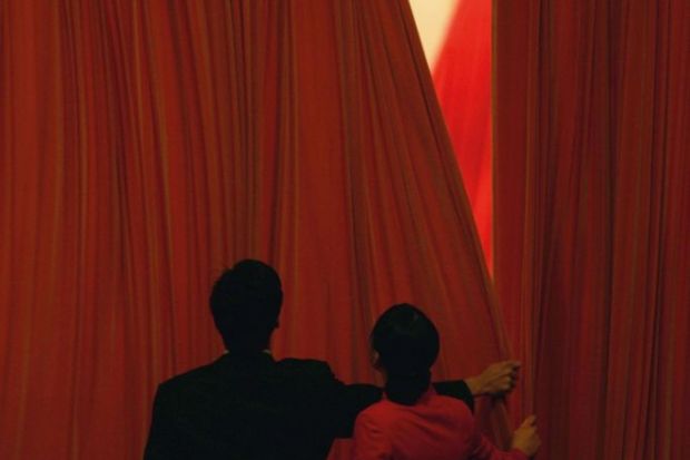Chinese attendants close the curtains during the closing ceremony of the National People's Congress to illustrate China takes ‘drastic’ action to punish research plagiarism