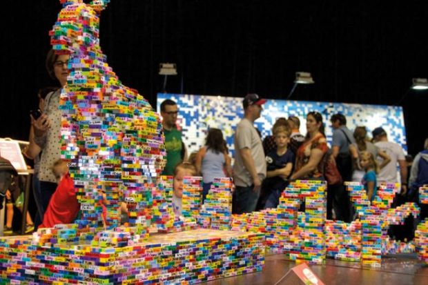 :Tourists viewing the lego brick sculptures with kangaroo at the Brickman Experience in Perth,Western Australia to illustrate Australian university launches block teaching how-to academy