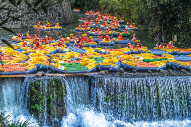 Tourists ride in inflatable boats as they go rafting in Cun an County, Hangzhou City, Zhejiang Province of China to illustrate African students on wrong side of China’s ‘two-track’ system