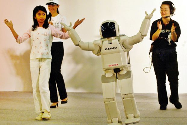 "Asimo", the world's first robot that walks like a human demanding applause from the crowd in Malaysia, Kuala Lumpur