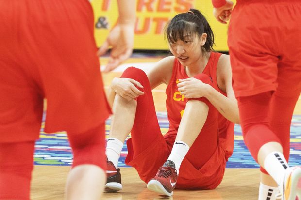 China's Han Xu ends up falling on court during the Women's Basketball World Cup Semi Final match between Australia and China at Sydney, Australia to illustrate China research at ‘crisis point’, Australian scholars warn