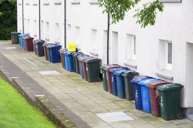 A row of wheelie bins, symbolising quality over quantity